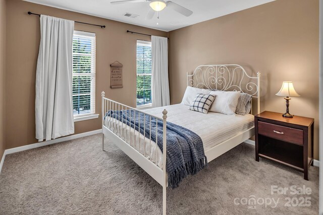 10792 Elsfield Ave NW, Concord, NC 28027 - carpeted bedroom featuring baseboards and ceiling fan