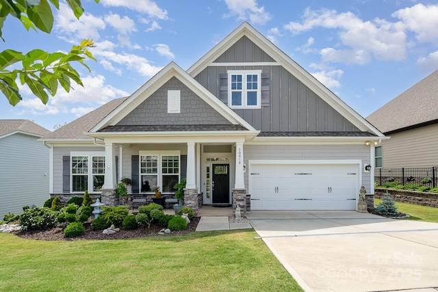 10016 St Kitts Landing Ln, Charlotte, NC 28278 - craftsman inspired home with board and batten siding, concrete driveway, a porch, and stone siding
