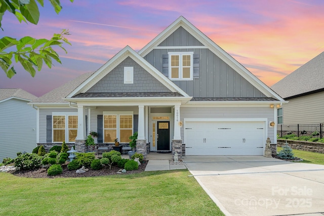 10016 St Kitts Landing Ln, Charlotte, NC 28278 - craftsman-style house with board and batten siding, driveway, a garage, a porch, and stone siding