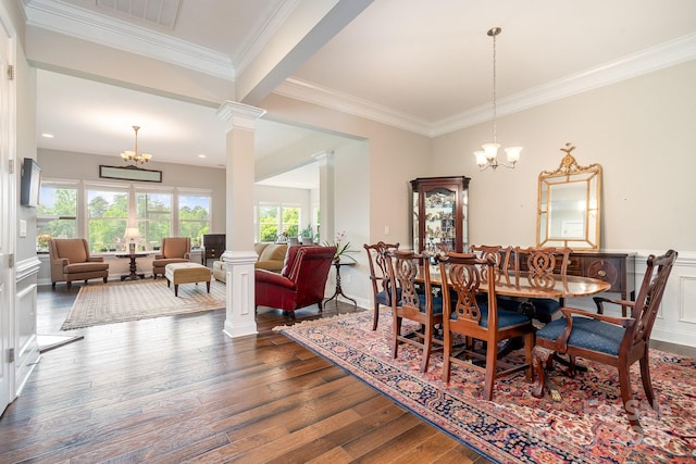 10016 St Kitts Landing Ln, Charlotte, NC 28278 - dining area featuring a chandelier, ornate columns, wood finished floors, and ornamental molding