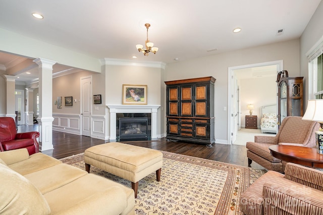 10016 St Kitts Landing Ln, Charlotte, NC 28278 - living area featuring decorative columns, ornamental molding, wood finished floors, wainscoting, and recessed lighting