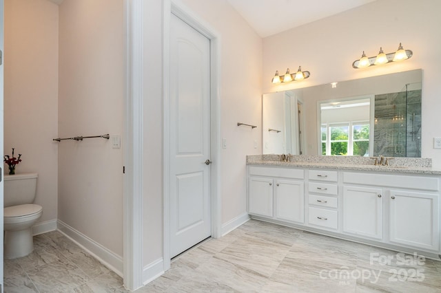 10016 St Kitts Landing Ln, Charlotte, NC 28278 - bathroom featuring double vanity, toilet, tiled shower, baseboards, and marble finish floors