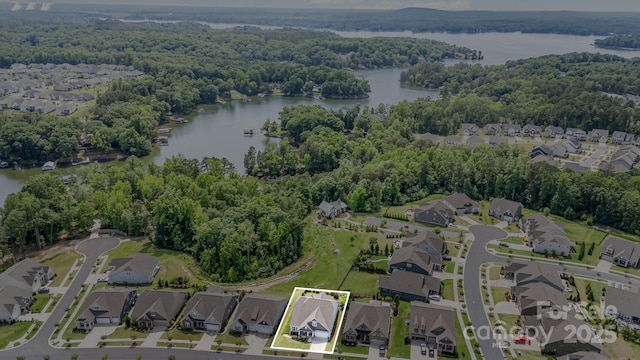 10016 St Kitts Landing Ln, Charlotte, NC 28278 - aerial overview of property's location featuring a heavily wooded area, property parcel outlined, nearby suburban area, and a large body of water