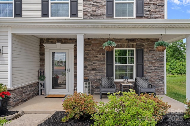 7331 Millstone Cir SW, Concord, NC 28025 - property entrance with stone siding and covered porch