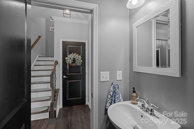 7331 Millstone Cir SW, Concord, NC 28025 - bathroom with a sink, wood finished floors, and crown molding
