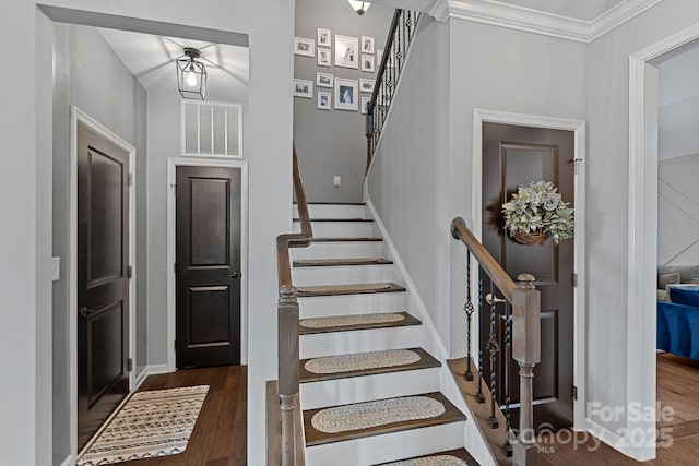 7331 Millstone Cir SW, Concord, NC 28025 - stairway with wood finished floors, crown molding, and baseboards