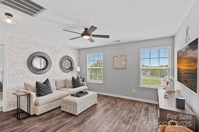 7331 Millstone Cir SW, Concord, NC 28025 - living area with wood finished floors, ceiling fan, brick wall, and baseboards