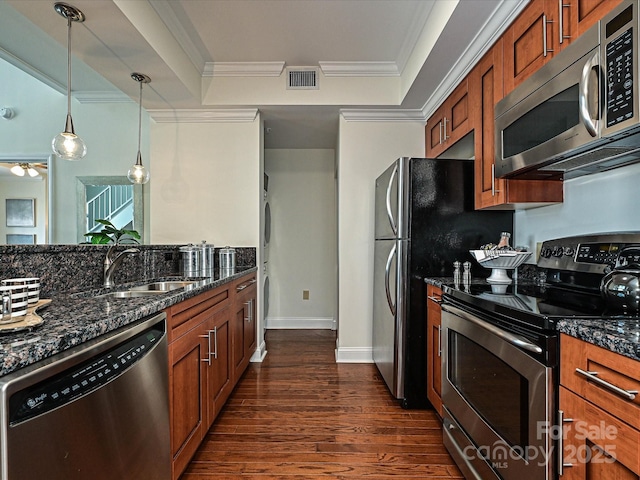 300 W 5th St Unit 723, Charlotte, NC 28202 - kitchen with appliances with stainless steel finishes, a sink, brown cabinetry, dark wood finished floors, and crown molding