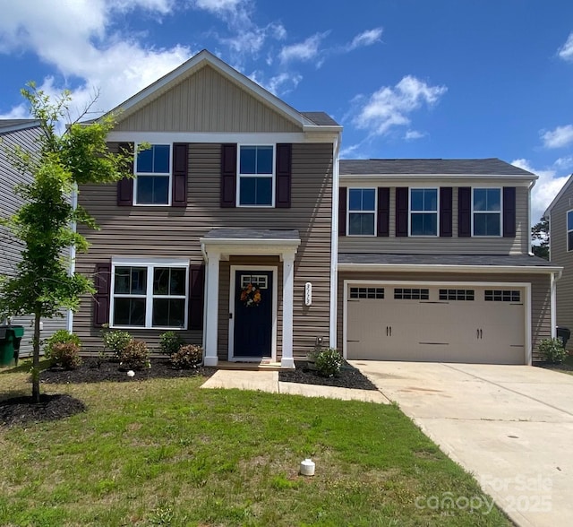 3113 Bouquet St, Charlotte, NC 28215 - view of front of home featuring a garage, driveway, and a front yard