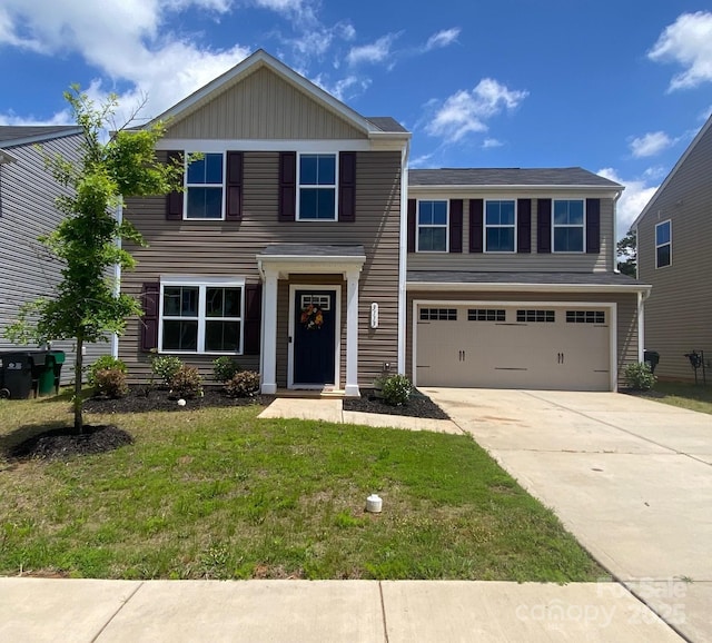 3113 Bouquet St, Charlotte, NC 28215 - view of front of home featuring driveway, a garage, and a front lawn