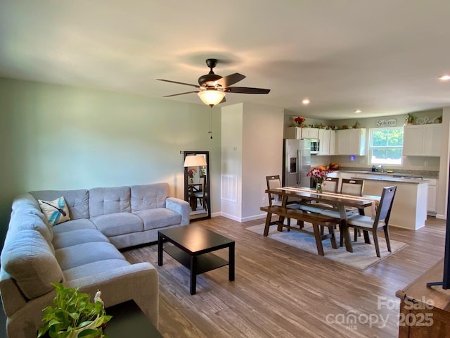 3113 Bouquet St, Charlotte, NC 28215 - living room with wood finished floors, baseboards, a ceiling fan, and recessed lighting