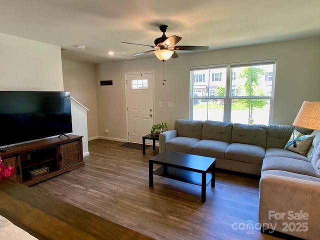 3113 Bouquet St, Charlotte, NC 28215 - living area featuring dark wood-style floors, ceiling fan, and baseboards