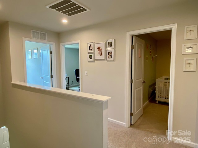 3113 Bouquet St, Charlotte, NC 28215 - hall with light carpet, baseboards, and recessed lighting