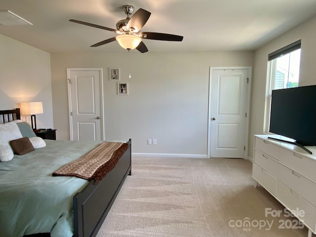 3113 Bouquet St, Charlotte, NC 28215 - bedroom with light carpet, ceiling fan, and baseboards
