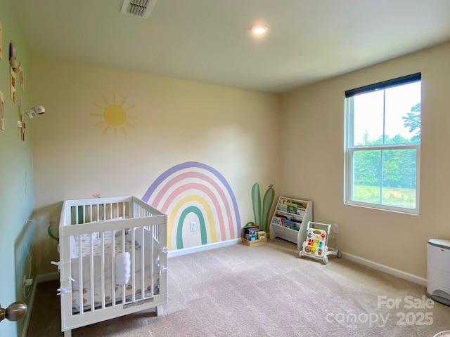 3113 Bouquet St, Charlotte, NC 28215 - bedroom featuring a nursery area, baseboards, and carpet flooring