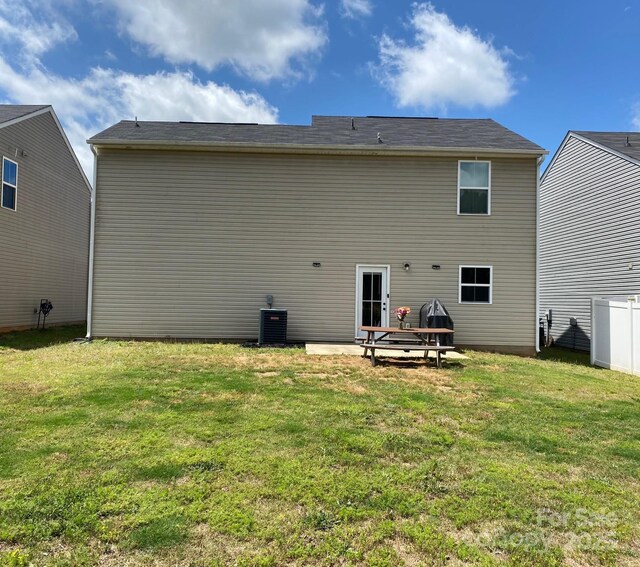 3113 Bouquet St, Charlotte, NC 28215 - rear view of property featuring a lawn and central AC unit