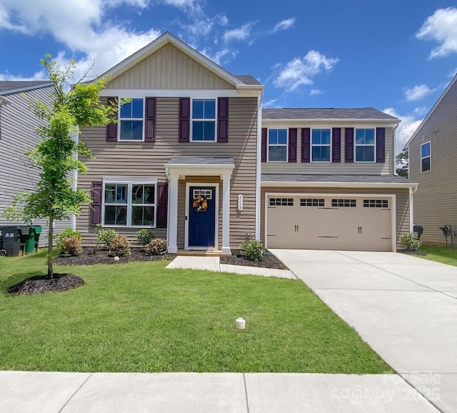 3113 Bouquet St, Charlotte, NC 28215 - view of front facade with concrete driveway, a garage, a front lawn, and board and batten siding
