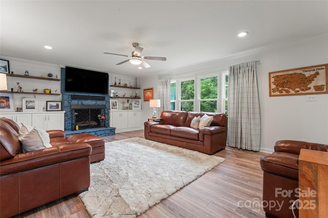 509 N Oak St, Lincolnton, NC 28092 - living room featuring ceiling fan, ornamental molding, a high end fireplace, baseboards, and wood finished floors