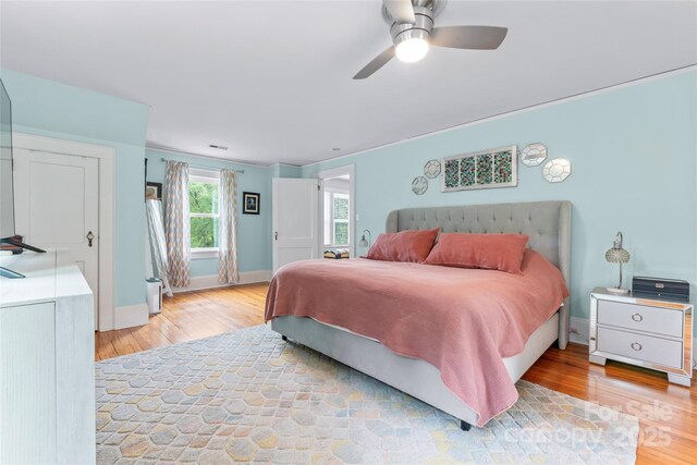 509 N Oak St, Lincolnton, NC 28092 - bedroom with light wood-type flooring, baseboards, and ceiling fan