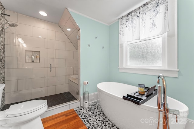 509 N Oak St, Lincolnton, NC 28092 - full bathroom with a shower stall, a soaking tub, toilet, baseboards, and recessed lighting