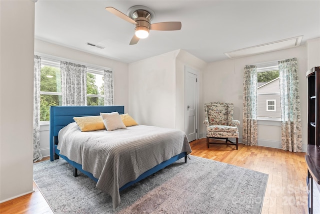 509 N Oak St, Lincolnton, NC 28092 - bedroom featuring attic access, wood-type flooring, baseboards, and a ceiling fan