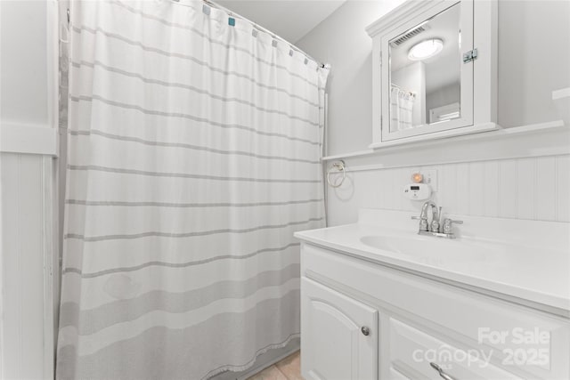 509 N Oak St, Lincolnton, NC 28092 - full bath with vanity and a wainscoted wall