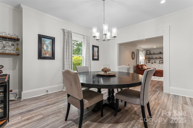 509 N Oak St, Lincolnton, NC 28092 - dining space with a chandelier, light wood finished floors, crown molding, baseboards, and recessed lighting