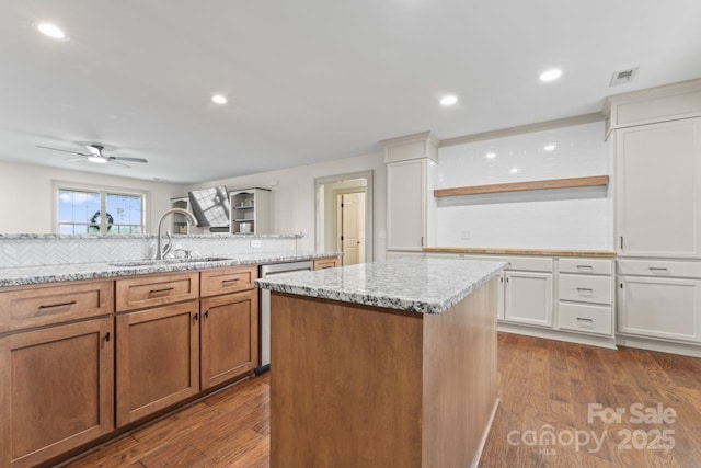 632 Skyland Dr N, Mount Pleasant, NC 28124 - kitchen featuring a sink, stainless steel dishwasher, backsplash, a center island, and recessed lighting