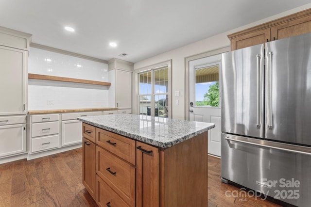 632 Skyland Dr N, Mount Pleasant, NC 28124 - kitchen featuring freestanding refrigerator, open shelves, backsplash, white cabinets, and light stone countertops