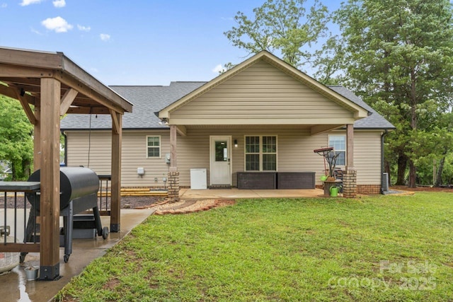 632 Skyland Dr N, Mount Pleasant, NC 28124 - rear view of house with a patio, a shingled roof, and a yard