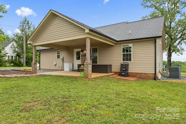 632 Skyland Dr N, Mount Pleasant, NC 28124 - rear view of house with a patio, a shingled roof, central AC unit, and a yard
