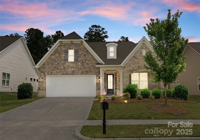 2236 Prairie Rd, Concord, NC 28027 - view of front of property with a front lawn, driveway, an attached garage, roof with shingles, and stone siding