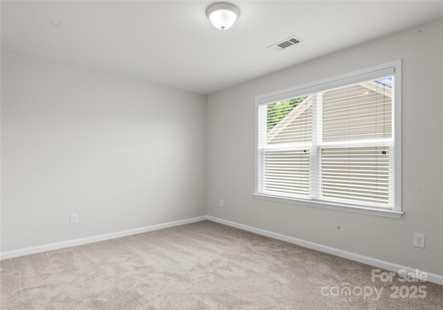 2236 Prairie Rd, Concord, NC 28027 - spare room featuring carpet and baseboards