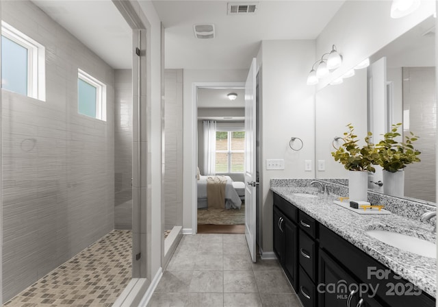 2236 Prairie Rd, Concord, NC 28027 - ensuite bathroom with double vanity, a tile shower, baseboards, and tile patterned flooring