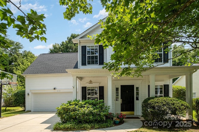 16121 Wrights Ferry Rd, Charlotte, NC 28278 - view of front of house with a garage, driveway, a porch, and roof with shingles