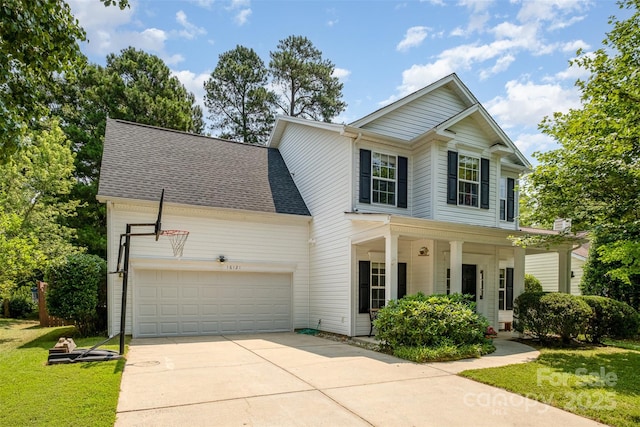 16121 Wrights Ferry Rd, Charlotte, NC 28278 - view of front facade with an attached garage, driveway, covered porch, a front yard, and a shingled roof