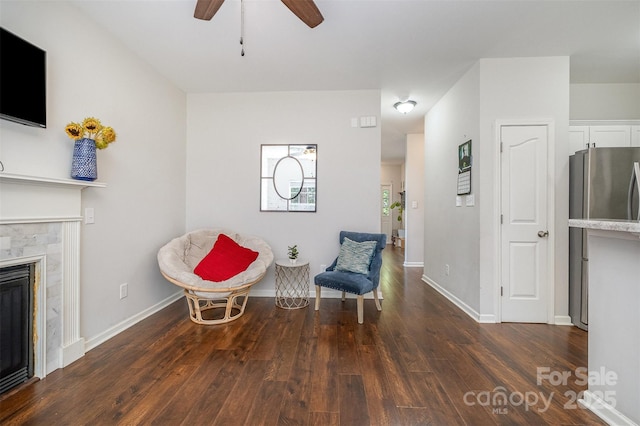 16121 Wrights Ferry Rd, Charlotte, NC 28278 - living area featuring dark wood-style floors, ceiling fan, a tile fireplace, and baseboards