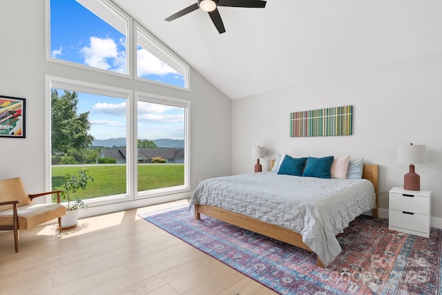 5 Loridon Dr, Weaverville, NC 28787 - bedroom featuring multiple windows, high vaulted ceiling, wood finished floors, a ceiling fan, and a mountain view