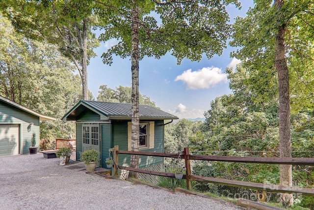 274 Slippery Rock Rd, Waynesville, NC 28785 - view of front of house with an outbuilding, a standing seam roof, and metal roof