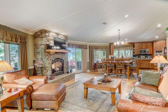 274 Slippery Rock Rd, Waynesville, NC 28785 - living area with healthy amount of natural light, a stone fireplace, ornamental molding, a chandelier, and recessed lighting