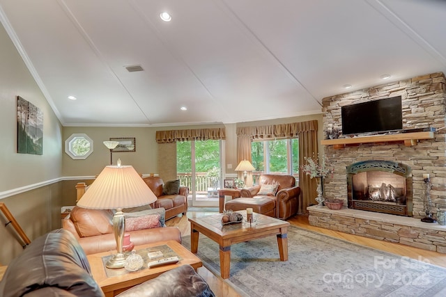 274 Slippery Rock Rd, Waynesville, NC 28785 - living area with ornamental molding, wood finished floors, a stone fireplace, and a wainscoted wall