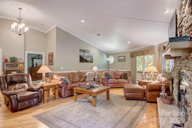 274 Slippery Rock Rd, Waynesville, NC 28785 - living area featuring light wood-type flooring, lofted ceiling, a chandelier, crown molding, and recessed lighting