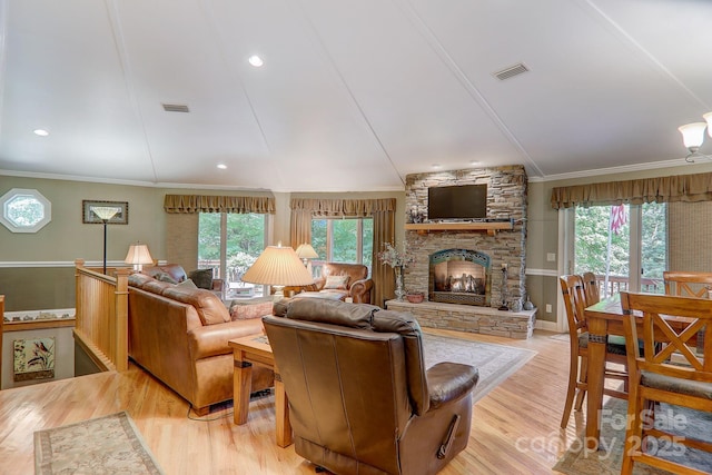 274 Slippery Rock Rd, Waynesville, NC 28785 - living room with ornamental molding, wood finished floors, and a stone fireplace