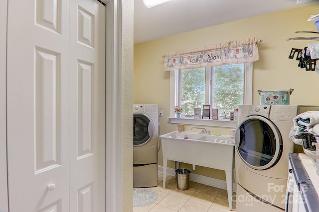 274 Slippery Rock Rd, Waynesville, NC 28785 - laundry area featuring tile patterned flooring, baseboards, and separate washer and dryer
