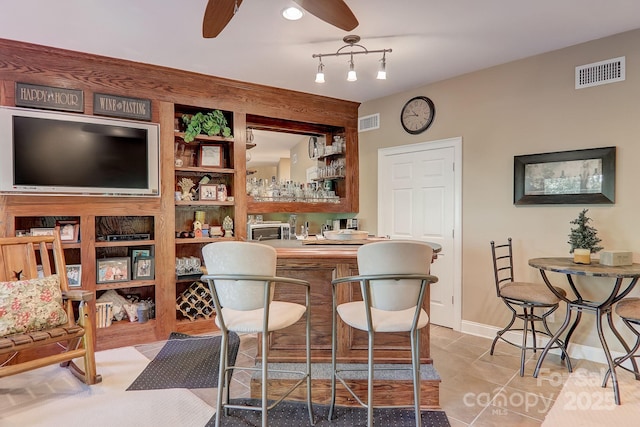 274 Slippery Rock Rd, Waynesville, NC 28785 - indoor bar featuring ceiling fan, light tile patterned floors, and baseboards