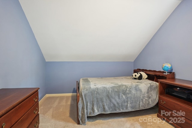 134 Lake Spring Loop, Mooresville, NC 28117 - bedroom with lofted ceiling, light carpet, and baseboards