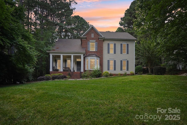 134 Lake Spring Loop, Mooresville, NC 28117 - view of front facade featuring a front lawn and brick siding