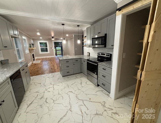 410 Gann St, Lowell, NC 28098 - kitchen with stainless steel appliances, gray cabinets, a peninsula, baseboards, and ornamental molding