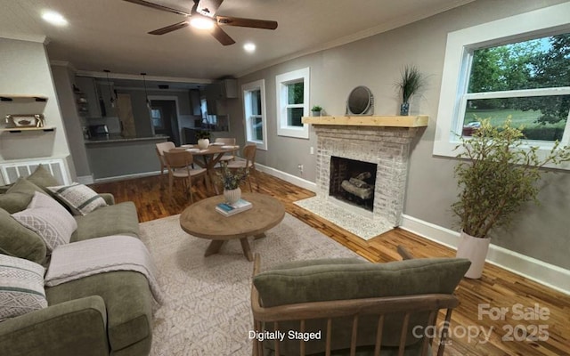 410 Gann St, Lowell, NC 28098 - living area with crown molding, ceiling fan, wood finished floors, healthy amount of natural light, and recessed lighting