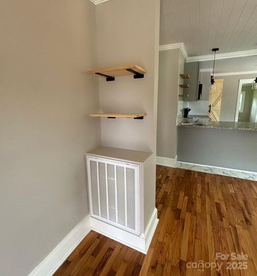 410 Gann St, Lowell, NC 28098 - corridor featuring ornamental molding and wood finished floors
